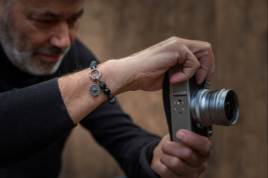men photographer with black diamond compass bracelet