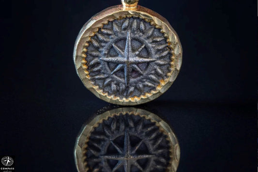 Round pendant yellow gold plus black Meridian compass